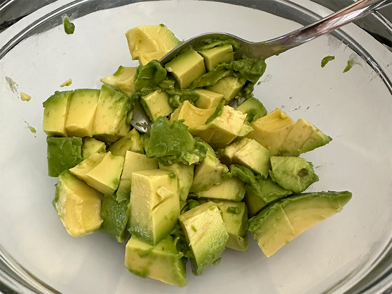 Chef Ena mixing avacado
